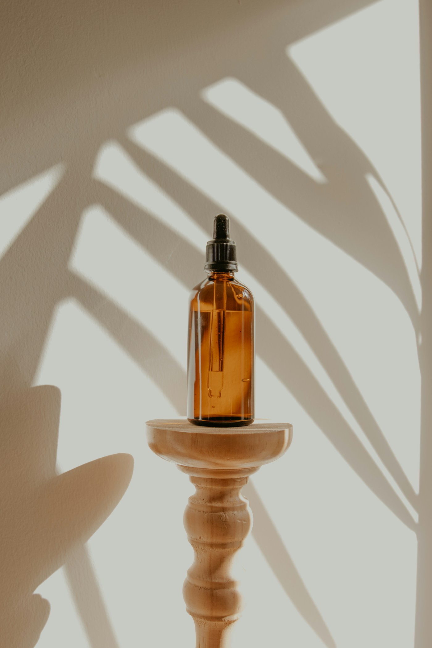 Beauty products arranged with natural botanicals